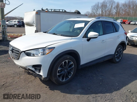 2016 Mazda CX-5 Grand Touring with VIN JM3KE4DYXG0836692, listed as a IAAI auction lot 41812584 with 119,302 mi miles. Bid and sale history available at carsss.com. Image 2.