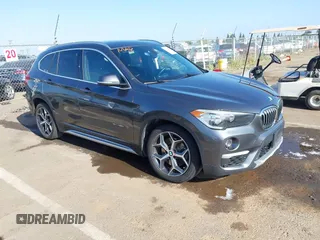 2017 BMW X1 sDrive28i z VIN WBXHU7C37H5H34113, wystawiony jako IAAI lot #42217296 z przebiegiem 124 452 mil mil oraz . Historia ofert i sprzedaży dostępna na DreamBid. Obrazek 1.