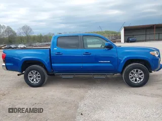 2018 Toyota Tacoma SR5 with VIN 3TMAZ5CNXJM069212, listed as a IAAI auction lot 42010564 with 73,825 mi miles and . Bid and sale history available at DreamBid. Image 13.