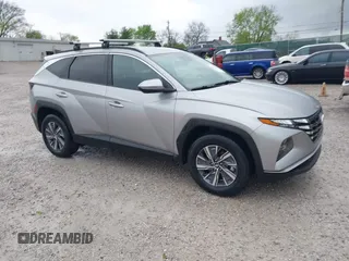 2022 Hyundai Tucson Blue z VIN KM8JBCA13NU077934, wystawiony jako IAAI lot #41920832 z przebiegiem 59 579 mil mil oraz . Historia ofert i sprzedaży dostępna na DreamBid. Obrazek 1.