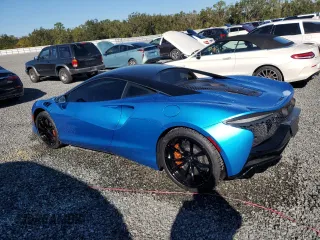 2023 McLaren Artura z VIN SBM16AEA2PW001739, wystawiony jako Copart lot #81910384 z przebiegiem 3871 mil mil oraz Szkody całkowita. Historia ofert i sprzedaży dostępna na DreamBid. Obrazek 2.