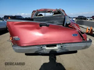 2000 Ford F-150 XL with VIN 1FTZX1728YNA87502, listed as a Copart auction lot 54870295 with 219,971 mi miles and Salvage title. Bid and sale history available at DreamBid. Image 6.