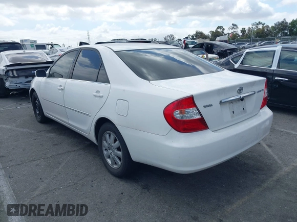 2003 Toyota Camry LE with VIN JTDBE32K530180834, listed as a IAAI auction lot 42255688 with 134,594 mi miles and . Bid and sale history available at DreamBid. Image 3.