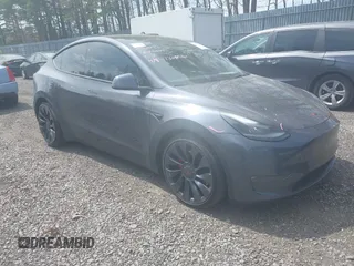 2022 Tesla Model Y Performance with VIN 7SAYGDEF3NF324705, listed as a IAAI auction lot 42076565 with 66,573 mi miles and . Bid and sale history available at carsss.com. Image 1.