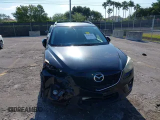 2014 Mazda CX-5 Touring with VIN JM3KE2CYXE0384987, listed as a IAAI auction lot 42052196 with 151,765 mi miles. Bid and sale history available at carsss.com. Image 6.