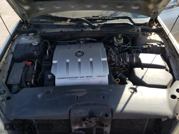2004 Cadillac DeVille DTS z VIN 1G6KF57994U203706, wystawiony jako Copart lot #76278324 z przebiegiem 203 709 mil mil oraz Szkoda całkowita • Salvage title. Historia ofert i sprzedaży dostępna na DreamBid. Obrazek 12.