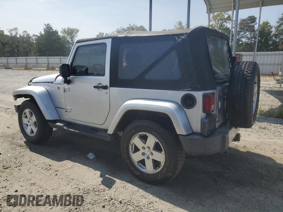 2009 Jeep Wrangler Sahara with VIN 1J4FA54119L747068, listed as a Copart auction lot 71209904 with 86,978 mi miles and Salvage title. Bid and sale history available at DreamBid. Image 2.