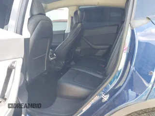 2021 Tesla Model Y Standard Range z VIN 5YJYGDED6MF107711, wystawiony jako IAAI lot #41794384 z przebiegiem 86 934 mil mil oraz . Historia ofert i sprzedaży dostępna na DreamBid. Obrazek 8.