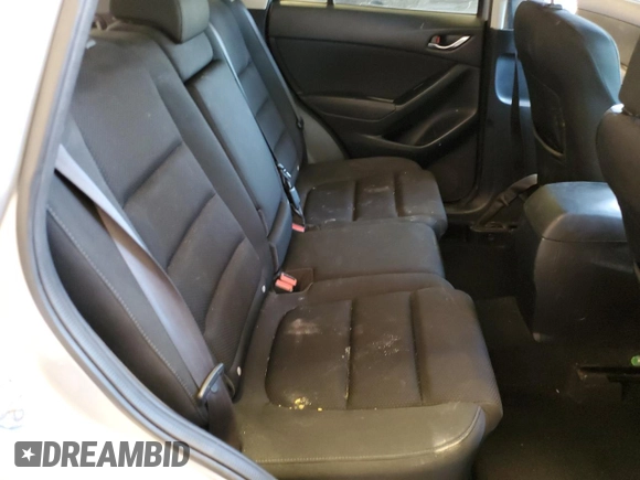 2016 Mazda CX-5 Touring with VIN JM3KE2CY0G0771566, listed as a Copart auction lot 52688255 with 142,204 mi miles and Salvage Title. Bid and sale history available at carsss.com. Image 12.