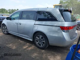 2014 Honda Odyssey Touring with VIN 5FNRL5H97EB054158, listed as a IAAI auction lot 42548360 with 91,161 mi miles and . Bid and sale history available at DreamBid. Image 3.