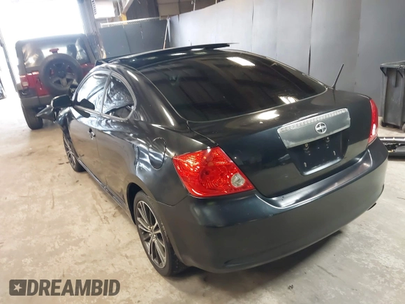2010 Scion tC with VIN JTKDE3B77A0320585, listed as a IAAI auction lot 39883404 with 140,409 mi miles. Bid and sale history available at carsss.com. Image 3.