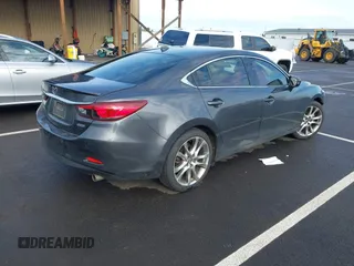 2014 Mazda 6 i Grand Touring with VIN JM1GJ1W63E1147380, listed as a IAAI auction lot 41928637 with 140,091 mi miles and . Bid and sale history available at DreamBid. Image 4.