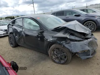 2021 Tesla Model Y Long Range z VIN 5YJYGDEE7MF093942, wystawiony jako Copart lot #54762425 z przebiegiem 20 492 mil mil oraz Szkoda całkowita • Salvage title. Historia ofert i sprzedaży dostępna na DreamBid. Obrazek 4.