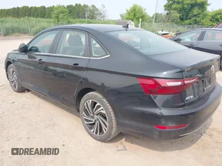 2020 Volkswagen Jetta SEL z VIN 3VWEB7BU9LM023817, wystawiony jako IAAI lot #42371694 z przebiegiem 99 100 mil mil oraz . Historia ofert i sprzedaży dostępna na DreamBid. Obrazek 3.