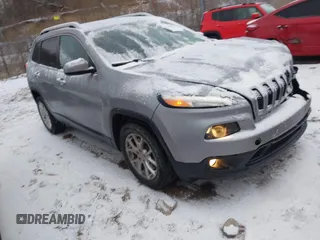 2015 Jeep Cherokee Latitude with VIN 1C4PJLCS4FW590087, listed as a IAAI auction lot 41313014 with 119,898 mi miles. Bid and sale history available at carsss.com. Image 1.