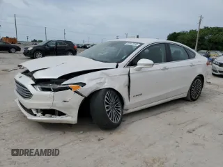 2017 Ford Fusion Hybrid Titanium with VIN 3FA6P0RU0HR320951, listed as a Copart auction lot 56747035 with Not provided miles and Salvage title. Bid and sale history available at DreamBid. Image 1.