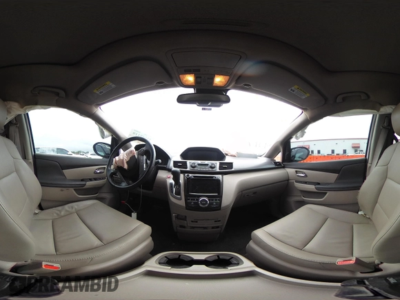2014 Honda Odyssey Touring with VIN 5FNRL5H95EB059729, listed as a IAAI auction lot 42148110 with 135,304 mi miles and . Bid and sale history available at DreamBid. Image 19.