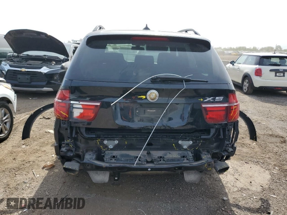 2012 BMW X5 50i with VIN 5UXZV8C59CL424356, listed as a Copart auction lot 54763725 with 107,712 mi miles and Salvage title. Bid and sale history available at DreamBid. Image 6.