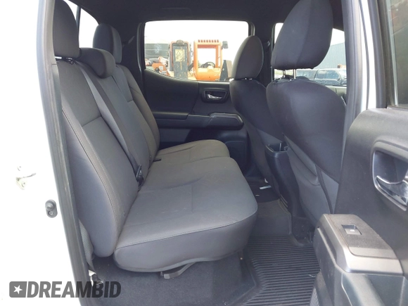 2018 Toyota Tacoma SR5 with VIN 3TMDZ5BN5JM048038, listed as a IAAI auction lot 42084922 with 79,718 mi miles and . Bid and sale history available at DreamBid. Image 8.