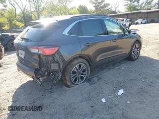 2020 Ford Escape Titanium Hybrid with VIN 1FMCU9DZ2LUA86600, listed as a IAAI auction lot 42059830 with 76,998 mi miles and . Bid and sale history available at DreamBid. Image 4.