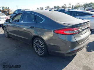 2017 Ford Fusion Energi Titanium with VIN 3FA6P0SU5HR105477, listed as a IAAI auction lot 41072696 with 92,926 mi miles. Bid and sale history available at carsss.com. Image 3.
