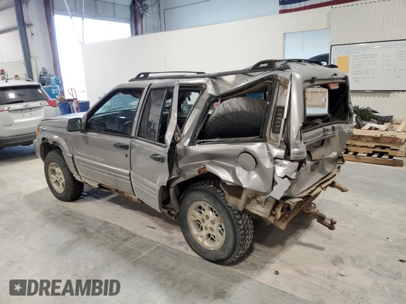 1997 Jeep Grand Cherokee Limited with VIN 1J4GZ78Y4VC589688, listed as a Copart auction lot 84673974 with 183,930 mi miles and Salvage Title. Bid and sale history available at carsss.com. Image 2.