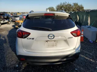 2016 Mazda CX-5 Sport with VIN JM3KE2BY3G0877107, listed as a Copart auction lot 87621635 with 83,093 mi miles and Salvage Title. Bid and sale history available at carsss.com. Image 6.