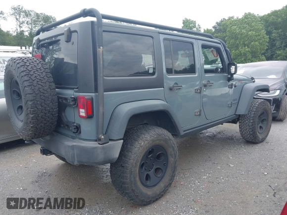 2015 Jeep Wrangler Unlimited Sport with VIN 1C4HJWDG1FL635620, listed as a IAAI auction lot 42396137 with 87,352 mi miles and . Bid and sale history available at DreamBid. Image 4.