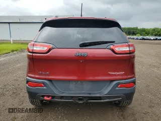 2014 Jeep Cherokee Trailhawk z VIN 1C4PJMBS2EW130125, wystawiony jako Copart lot #57830635 z przebiegiem 117 811 mil mil oraz Szkody całkowita. Historia ofert i sprzedaży dostępna na DreamBid. Obrazek 6.