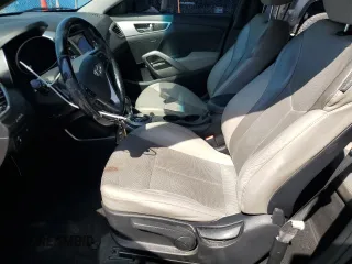 2014 Hyundai Veloster with VIN KMHTC6AD0EU207850, listed as a Copart auction lot 46986695 with 138,024 mi miles and Salvage Title. Bid and sale history available at carsss.com. Image 7.