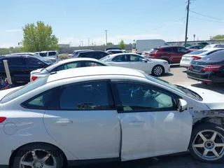 2017 Ford Focus SE with VIN 1FADP3F24HL232527, listed as a IAAI auction lot 42110702 with 95,327 mi miles and . Bid and sale history available at DreamBid. Image 14.