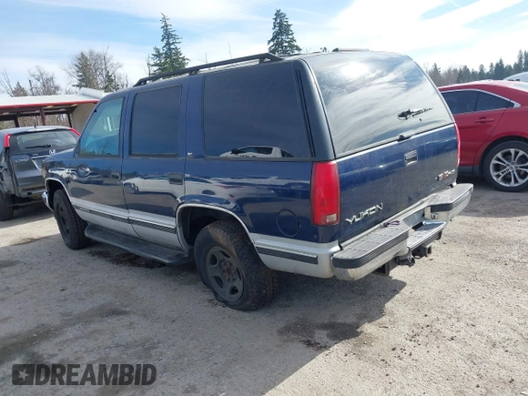 1997 GMC Yukon with VIN 1GKEK13R8VJ737324, listed as a IAAI auction lot 41675479 with 237,223 mi miles. Bid and sale history available at carsss.com. Image 3.