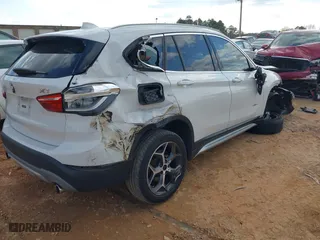 2018 BMW X1 sDrive28i with VIN WBXHU7C37J5H39401, listed as a IAAI auction lot 41421610 with 94,576 mi miles. Bid and sale history available at carsss.com. Image 4.