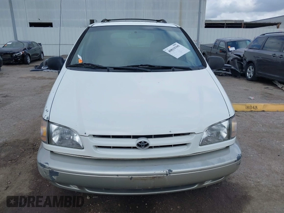 1999 Toyota Sienna LE with VIN 4T3ZF13C1XU152733, listed as a IAAI auction lot 40819395 with 184,540 mi miles. Bid and sale history available at carsss.com. Image 12.