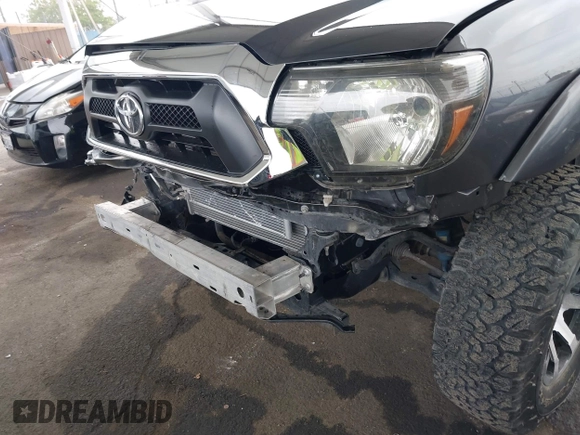 2015 Toyota Tacoma with VIN 3TMLU4EN8FM167337, listed as a IAAI auction lot 42117662 with 60,929 mi miles. Bid and sale history available at carsss.com. Image 6.