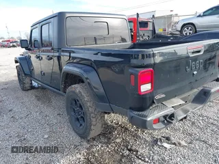 2023 Jeep Gladiator Sport S z VIN 1C6HJTAG7PL567903, wystawiony jako IAAI lot #41574387 z przebiegiem 49 378 mil mil oraz . Historia ofert i sprzedaży dostępna na DreamBid. Obrazek 3.