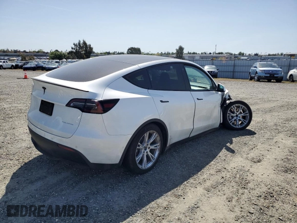 2022 Tesla Model Y Long Range z VIN 7SAYGAEE6NF492070, wystawiony jako Copart lot #52032415 z przebiegiem 143 732 mil mil oraz Szkody całkowita. Historia ofert i sprzedaży dostępna na DreamBid. Obrazek 3.