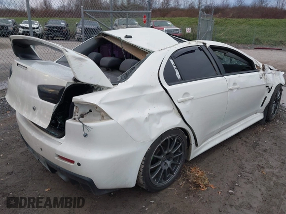 2014 Mitsubishi Lancer Evolution GSR with VIN JA32W8FV5EU012572, listed as a IAAI auction lot 40871463 with 89,529 mi miles. Bid and sale history available at carsss.com. Image 4.