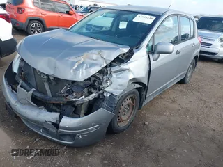 2012 Nissan Versa S with VIN 3N1BC1CPXCK229848, listed as a IAAI auction lot 41955230 with 194,702 mi miles. Bid and sale history available at carsss.com. Image 2.