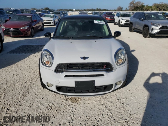 2016 MINI Countryman S with VIN WMWZC5C51GWU01290, listed as a Copart auction lot 77684384 with 106,811 mi miles and Salvage Title. Bid and sale history available at DreamBid. Image 5.