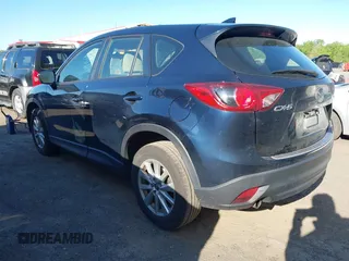 2016 Mazda CX-5 Sport with VIN JM3KE2BY3G0657904, listed as a IAAI auction lot 42127897 with 153,855 mi miles. Bid and sale history available at carsss.com. Image 3.