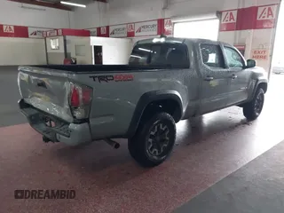 2021 Toyota Tacoma SR5 z VIN 3TMDZ5BN5MM114494, wystawiony jako IAAI lot #41723032 z przebiegiem 54 477 mil mil oraz . Historia ofert i sprzedaży dostępna na DreamBid. Obrazek 4.