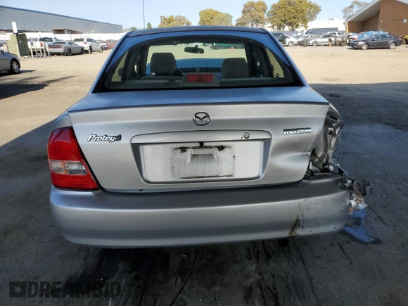2002 Mazda Protege DX with VIN JM1BJ225120605237, listed as a Copart auction lot 49331225 with 184,556 mi miles and Salvage Title. Bid and sale history available at DreamBid. Image 6.