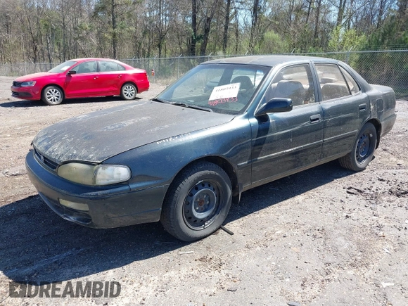1995 Toyota Camry LE with VIN 4T1GK12E5SU860216, listed as a IAAI auction lot 41803933 with 235,130 mi miles. Bid and sale history available at carsss.com. Image 2.
