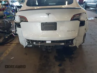 2021 Tesla Model Y Performance with VIN 5YJYGDEF4MF263473, listed as a IAAI auction lot 41851083 with 39,289 mi miles and . Bid and sale history available at DreamBid. Image 6.