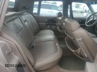 1990 Cadillac Brougham z VIN 1G6DW54Y1LR710024, wystawiony jako Copart lot #88406975 z przebiegiem 183 170 mil mil oraz Tytuł czysty. Historia ofert i sprzedaży dostępna na DreamBid. Obrazek 10.