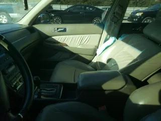2000 Acura RL with VIN JH4KA9657YC004956, listed as a Copart auction lot 77944634 with 0 mi miles and Salvage Title. Bid and sale history available at carsss.com. Image 7.