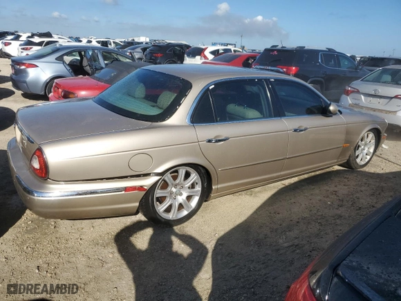 2005 Jaguar XJ with VIN SAJWA79C05SG46913, listed as a Copart auction lot 75092794 with 0 mi miles and Salvage Title. Bid and sale history available at carsss.com. Image 3.