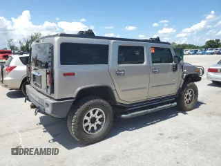2003 Hummer H2 z VIN 5GRGN23U33H142552, wystawiony jako Copart lot #61152055 z przebiegiem Nie podano mil oraz Czysty tytuł • Clean title. Historia ofert i sprzedaży dostępna na DreamBid. Obrazek 3.