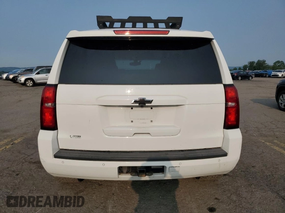 2015 Chevrolet Tahoe Commercial with VIN 1GNLC2EC1FR296841, listed as a Copart auction lot 60160605 with 105,096 mi miles and Salvage title. Bid and sale history available at DreamBid. Image 6.
